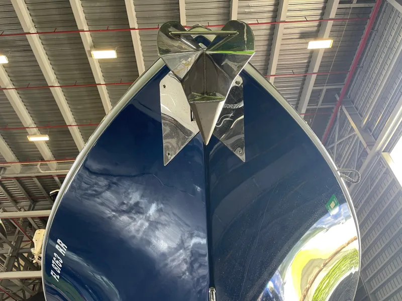 Slide: The Image of 2018 Cobia 301 Center Console boat bow with anchor in a storage facility. - 6