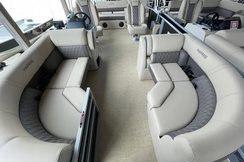 The Image of Luxurious interior of 2026 Harris Cruiser 210 pontoon boat with plush seating. - 0