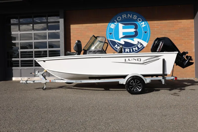 The Image of 2026 Lund 1675 Adventure Sport boat on trailer at Bjornson Marine dealership. - 1