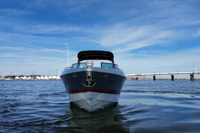 Slide: The Image of 2014 Formula 310 Bowrider on water, clear sky, bridge in background. - 12