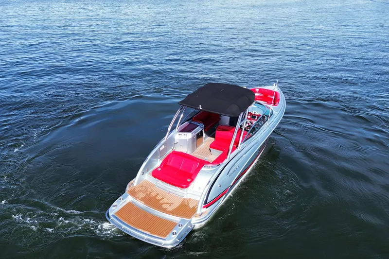 Slide: The Image of 2014 Formula 310 Bowrider on open water, featuring sleek design and vibrant red seating. - 17