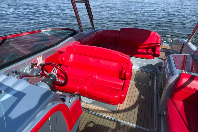 Slide: The Image of 2014 Formula 310 Bowrider with vibrant red seating on a sunny day. - 23