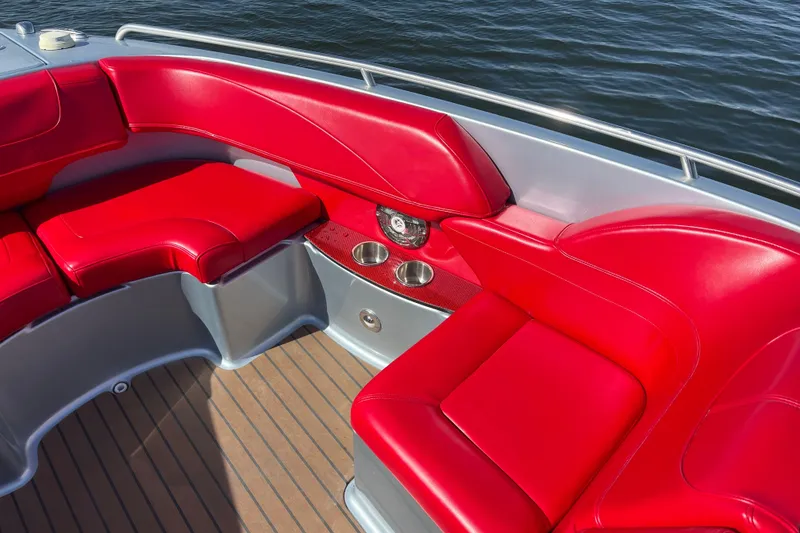 Slide: The Image of 2014 Formula 310 Bowrider with vibrant red seating and sleek design on the water. - 32
