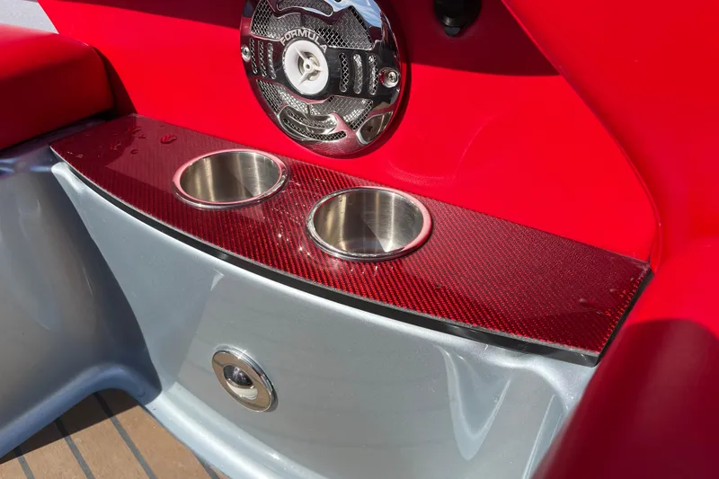 Slide: The Image of Red and silver interior of 2014 Formula 310 Bowrider with cup holders and speaker. - 33