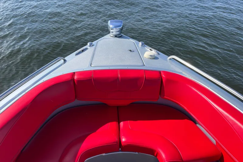 Slide: The Image of 2014 Formula 310 Bowrider with red seating, cruising on calm water. - 34