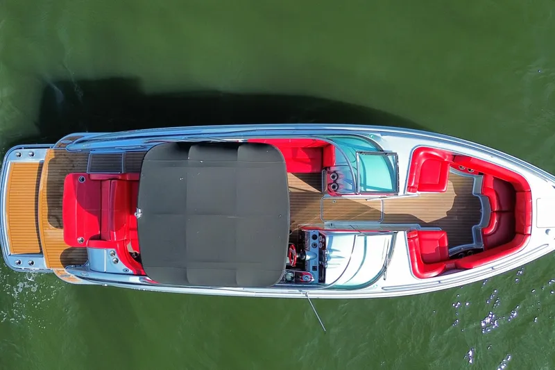 Slide: The Image of 2014 Formula 310 Bowrider with red seating, aerial view on water. - 8