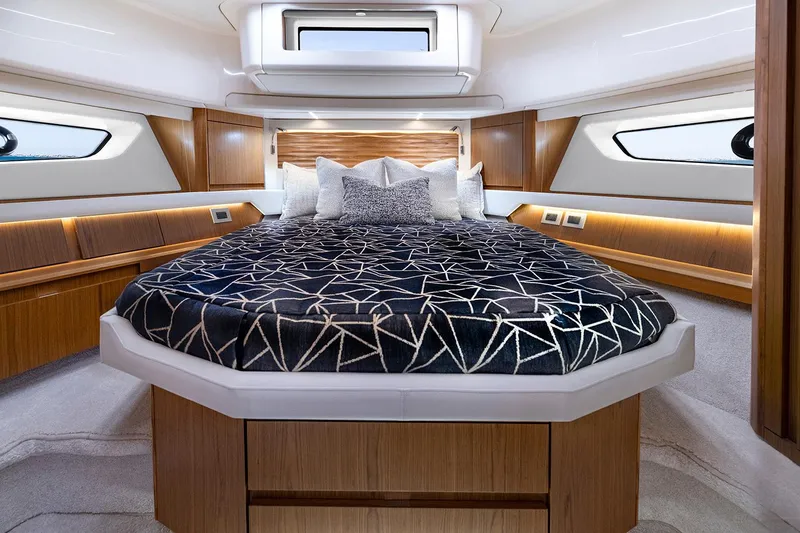 Slide: The Image of Manufacturer Provided Image: Luxurious 2025 Tiara Yachts EX 54 bedroom interior with modern design and elegant bedding. - 17
