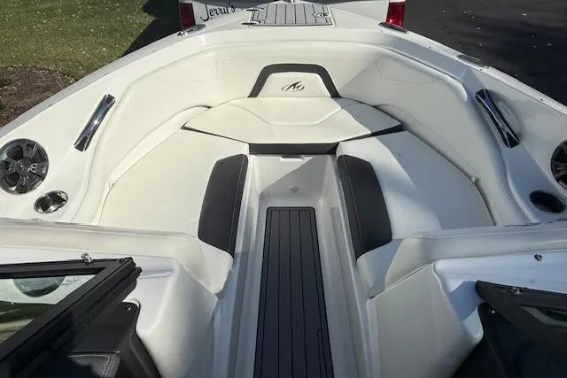 Slide: The Image of Open storage compartment on 2018 Monterey 224FS boat with fenders and ropes. - 16