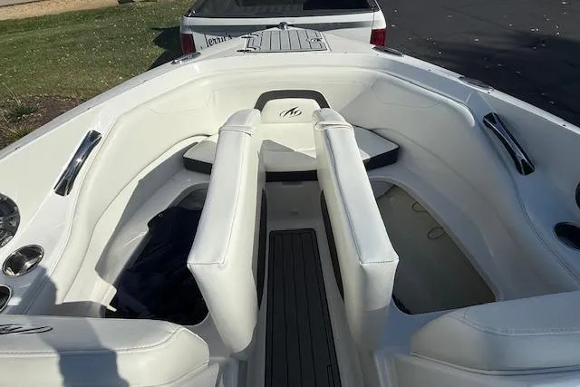 Slide: The Image of 2018 Monterey 224FS boat interior with white seating and black accents. - 17