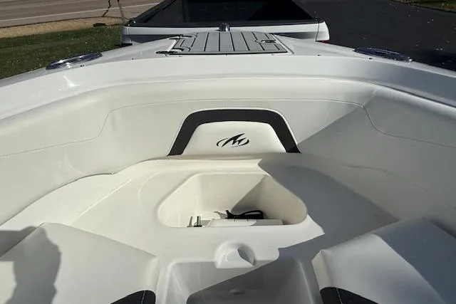 Slide: The Image of 2018 Monterey 224FS boat interior with white seating and sleek design. - 18
