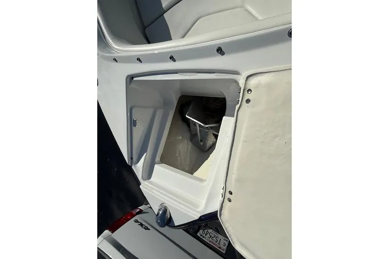 Slide: The Image of 2018 Monterey 224FS boat interior with seating and storage compartment. - 19