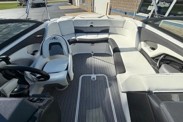 Slide: The Image of Open storage compartment on a 2018 Monterey 224FS boat, showing interior details. - 20