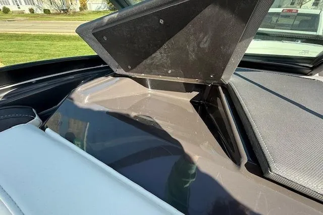 Slide: The Image of 2018 Monterey 224FS boat interior with open storage compartment. - 26