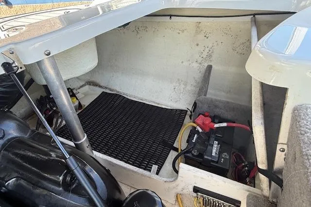 Slide: The Image of 2018 Monterey 224FS boat engine compartment with battery and storage area. - 30