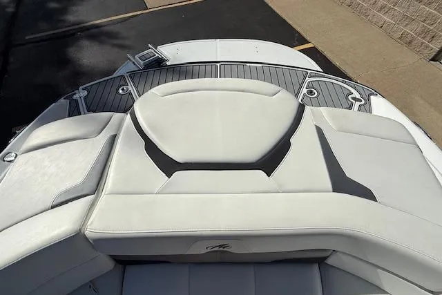 Slide: The Image of 2018 Monterey 224FS boat deck with cushioned seating and sleek design. - 31