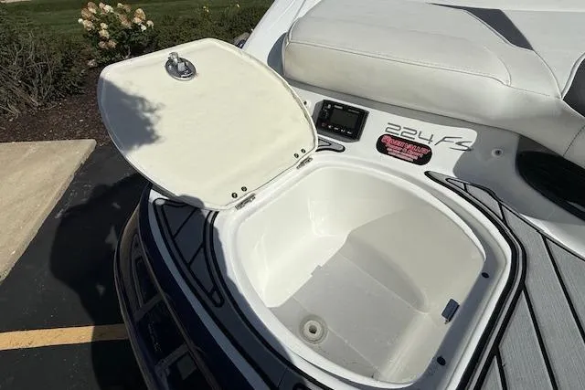 Slide: The Image of Open storage compartment on a 2018 Monterey 224FS boat, showcasing interior space. - 32