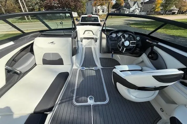 Slide: The Image of Interior of a 2018 Monterey 224FS boat with sleek seating and modern dashboard. - 6