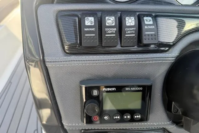 Slide: The Image of 2018 Monterey 224FS boat cockpit with steering wheel and dashboard controls. - 9