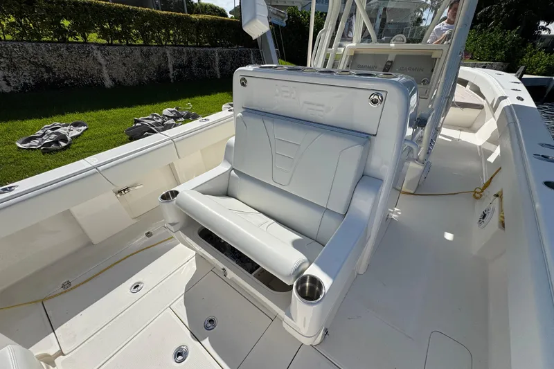 Slide: The Image of 2023 SeaVee 340Z boat interior with cushioned seating and control panel. - 10