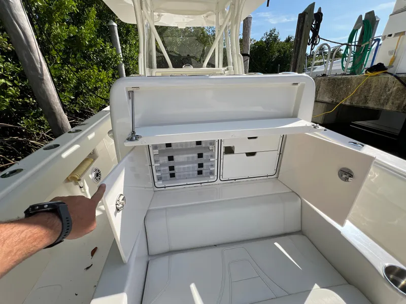 Slide: The Image of 2023 SeaVee 340Z boat storage compartments and seating area. - 21