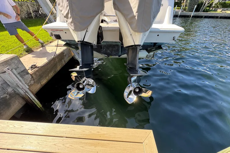 Slide: The Image of 2023 SeaVee 340Z boat with dual outboard motors docked by the water. - 36