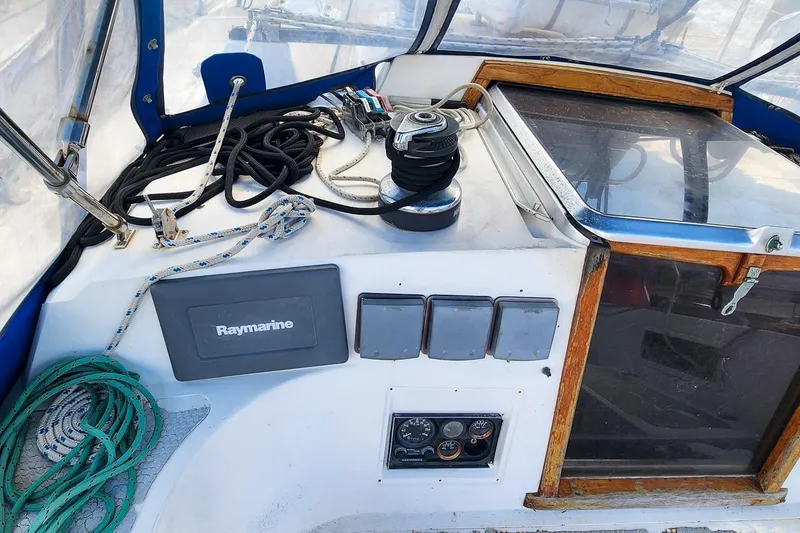 Slide: The Image of Cockpit of 1980 Nordic 44 sailboat with Raymarine equipment and ropes. - 22