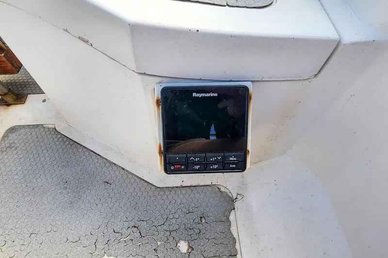 Slide: The Image of Raymarine navigation device on 1980 Nordic 44 boat with worn flooring. - 23