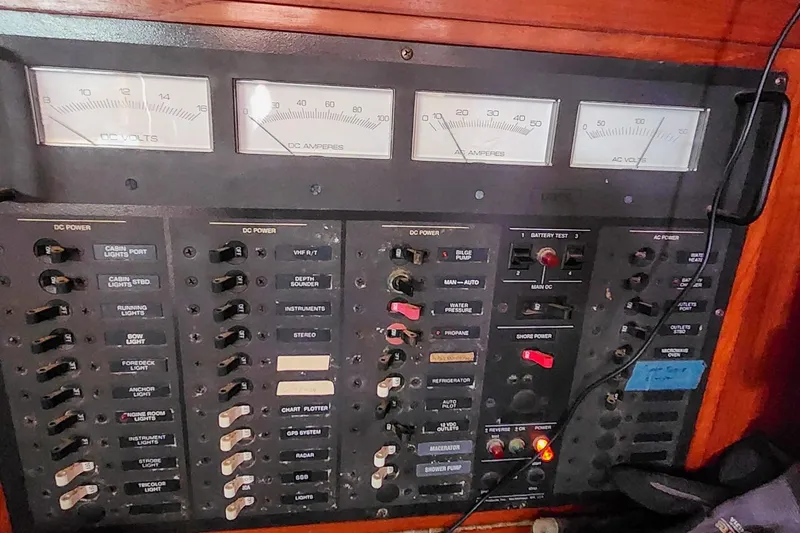 Slide: The Image of Electrical control panel on a 1980 Nordic 44 boat with gauges and switches. - 33