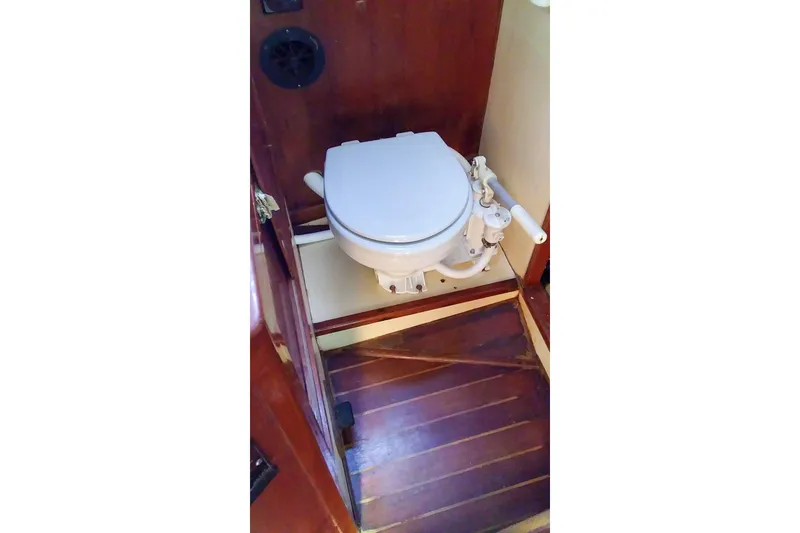 Slide: The Image of Vintage 1980 Nordic 44 boat toilet with wooden flooring and manual pump. - 35