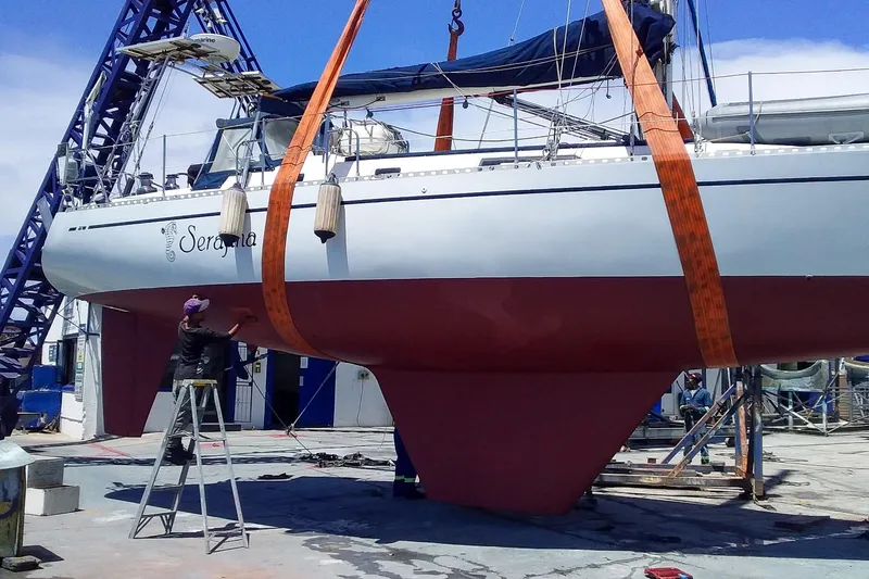 Slide: The Image of Sailboat Nordic 44 from 1980 in dry dock, undergoing maintenance and inspection. - 41