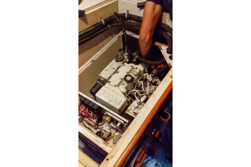 Slide: The Image of Engine maintenance on a 1980 Nordic 44 sailboat, showcasing detailed mechanical components. - 44