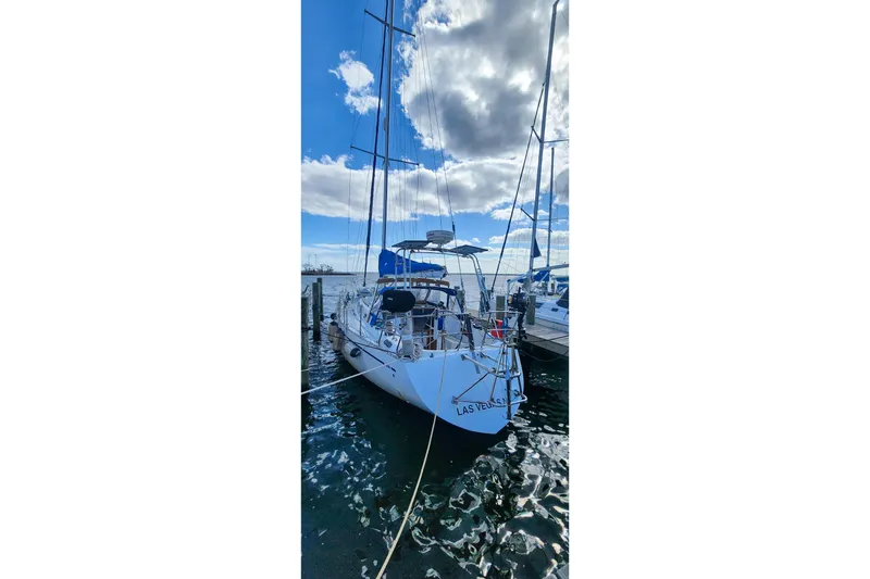 Slide: The Image of Sailboat docked under cloudy sky, Nordic 44 model, 1980. - 8