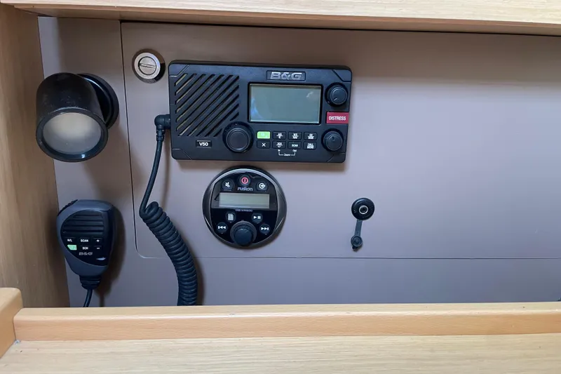 Slide: The Image of Control panel of a 2016 Beneteau Oceanis 38 sailboat with communication equipment. - 21