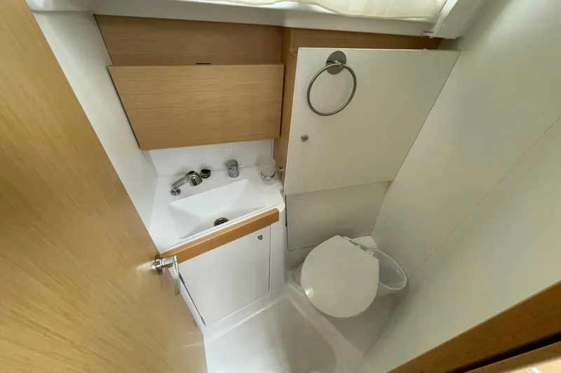 Slide: The Image of Compact bathroom in 2016 Beneteau Oceanis 38 yacht with sink and toilet. - 24