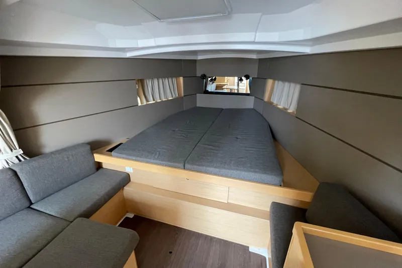 Slide: The Image of Interior of 2016 Beneteau Oceanis 38 yacht with cozy bed and seating area. - 30