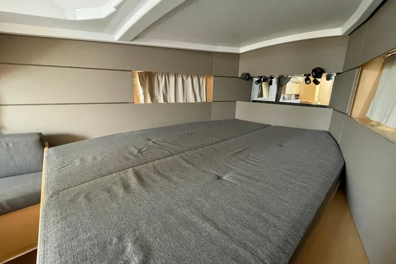 Slide: The Image of Interior cabin of 2016 Beneteau Oceanis 38 yacht with gray bedding and modern design. - 31