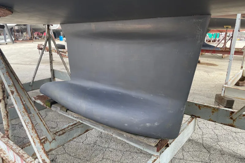 Slide: The Image of Keel of 2016 Beneteau Oceanis 38 sailboat on a metal stand. - 6