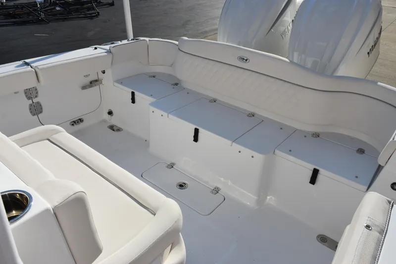 Slide: The Image of Spacious deck of 2026 Sea Hunt Ultra 265 SE boat with seating and storage. - 11
