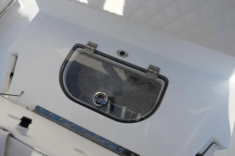 Slide: The Image of Livewell compartment on 2026 Sea Hunt Ultra 265 SE boat. - 19