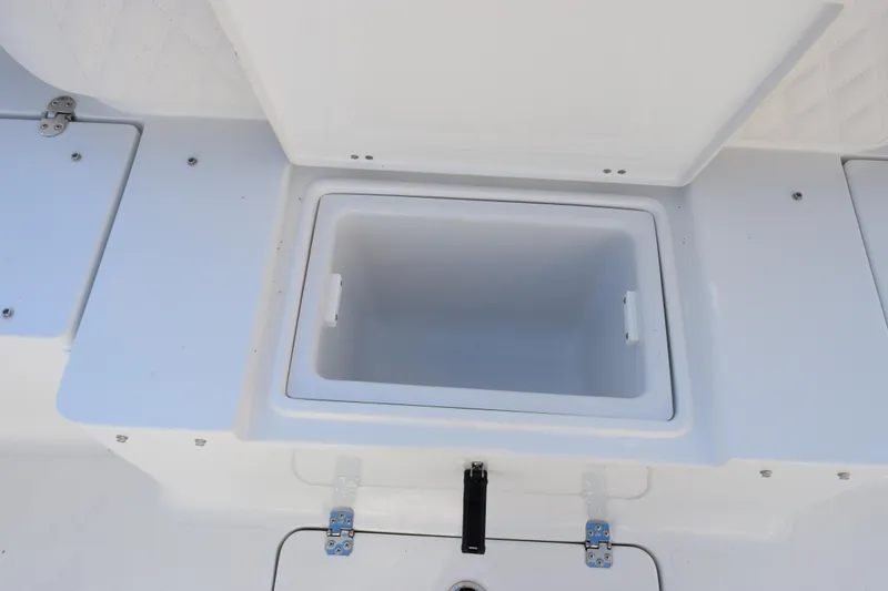 Slide: The Image of Open storage compartment on 2026 Sea Hunt Ultra 265 SE boat. - 20