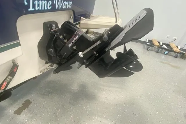 Slide: The Image of 2012 Bayliner 195 Discovery boat with MerCruiser outboard motor in a garage. - 3