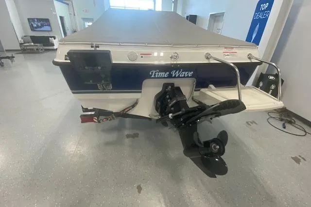 Slide: The Image of 2012 Bayliner 195 Discovery boat, rear view, in showroom with "Time Wave" name. - 4