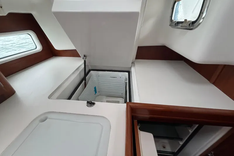 Slide: The Image of Interior of 2002 Beneteau Oceanis 411 yacht with open storage compartment. - 29