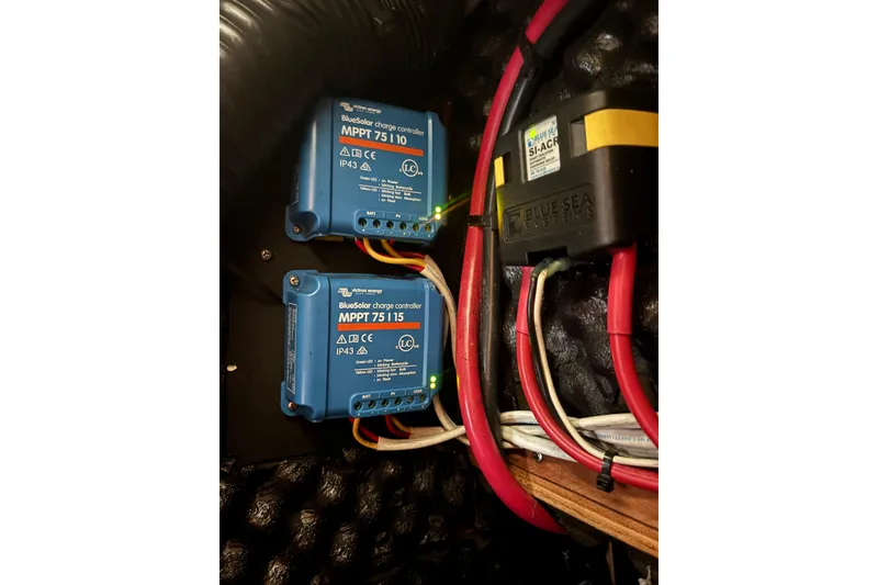 Slide: The Image of Electrical setup with Victron BlueSolar charge controllers on a 2002 Beneteau Oceanis 411 yacht. - 40