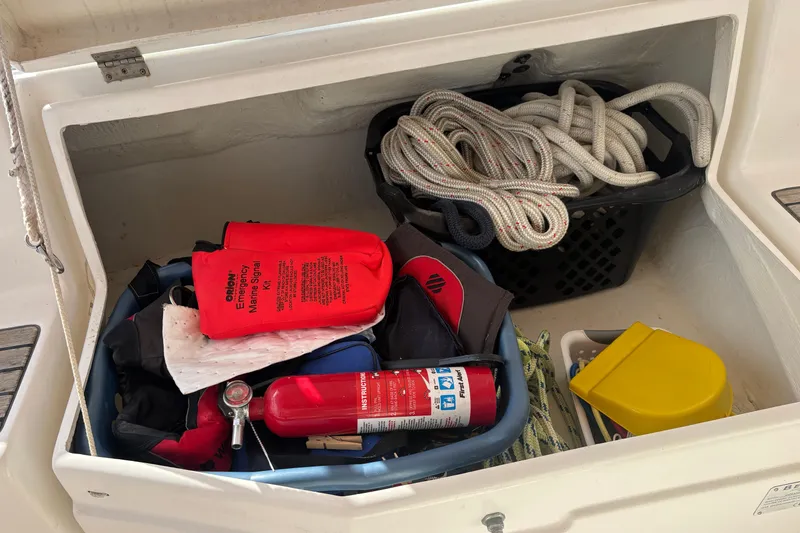 Slide: The Image of Storage compartment on a 2002 Beneteau Oceanis 411 with safety gear and ropes. - 41
