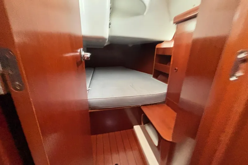 Slide: The Image of Cozy cabin interior of 2002 Beneteau Oceanis 411 sailboat with wooden finish. - 5