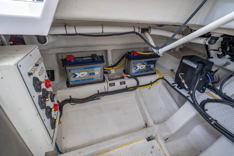 Slide: The Image of 2022 Cruisers Yachts 38 GLS OB engine compartment with batteries and wiring. - 42