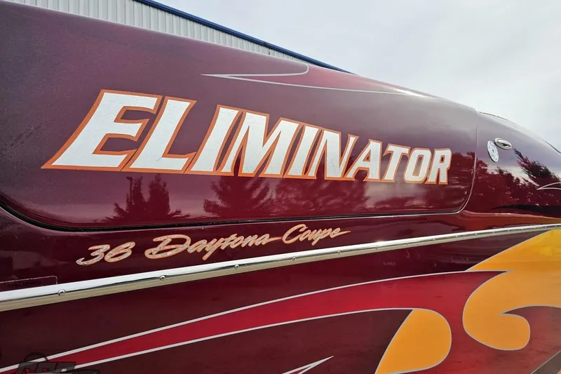 Slide: The Image of 2008 Eliminator 36 Daytona Coupe boat with bold graphics and sleek design. - 12