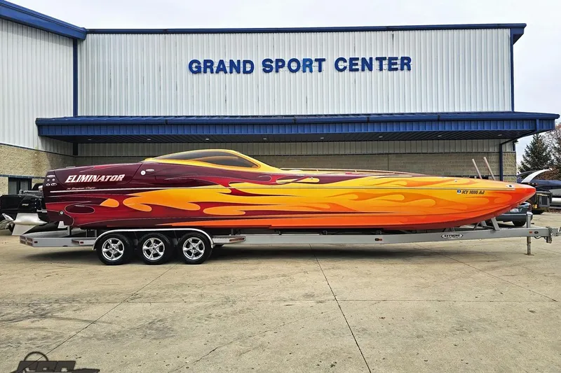 Slide: The Image of 2008 Eliminator 36 Daytona Coupe with vibrant flame design at Grand Sport Center. - 19