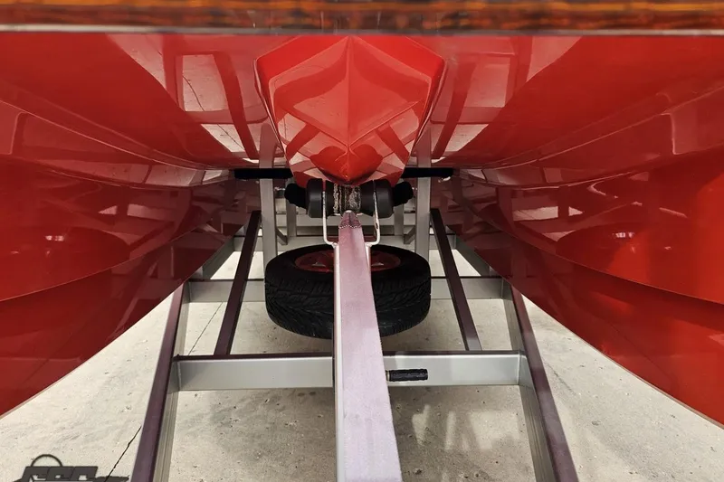 Slide: The Image of Underneath view of a 2008 Eliminator 36 Daytona Coupe boat on a trailer. - 27